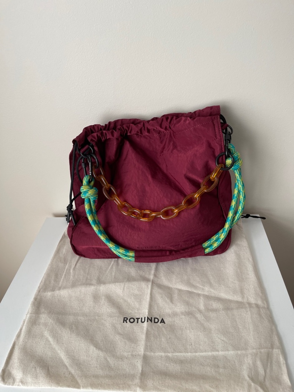 NWOT.  Burgundy Drawstring Shoulder Bag with Tortoiseshell Chain and Rope Accent
